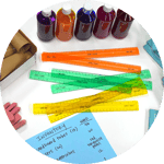 inventory in an art room: rulers, paint and paper listing each item